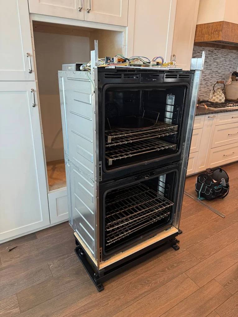 Wall oven pulled out for repair